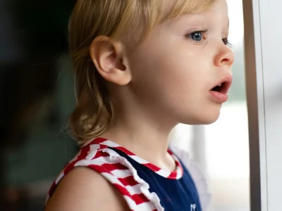 child looking out of a window