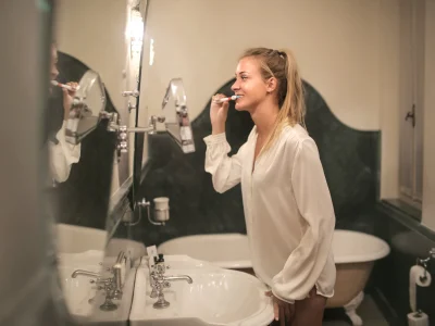 woman brushing her teeth